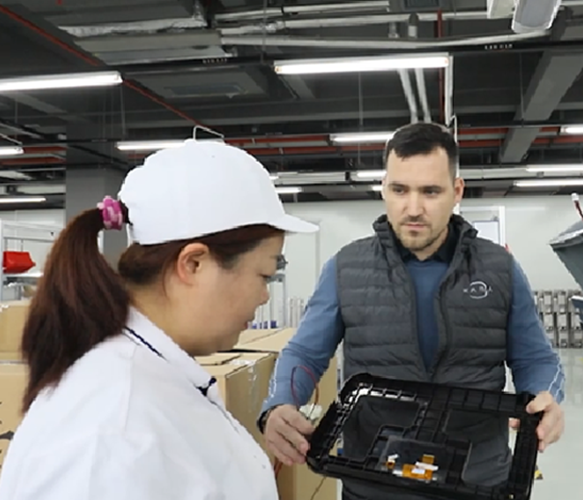 LeWorks operator inspecting parts